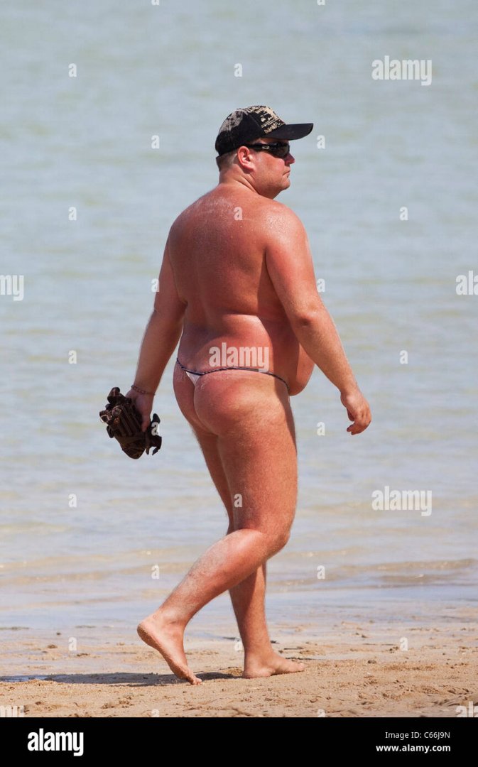 western-man-walking-on-a-beach-in-thailand-C66J9N.jpg